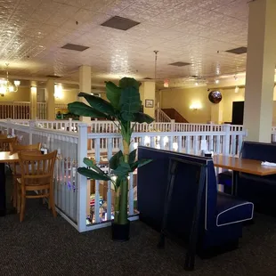 a dining area with tables and chairs