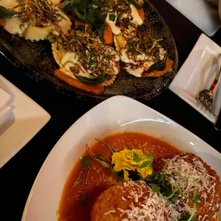 a plate of meatballs and a bowl of sauce