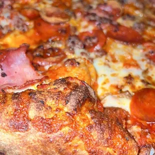 a pepperoni pizza on a platter