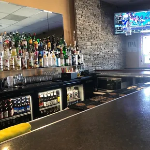 Long counter with many flatscreens.