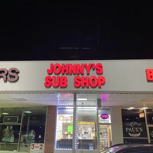 a car parked in front of the store