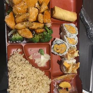 Lunch bento bowl (teriyaki salmon, brown rice, sweet potato roll, abd veggie egg roll) $15