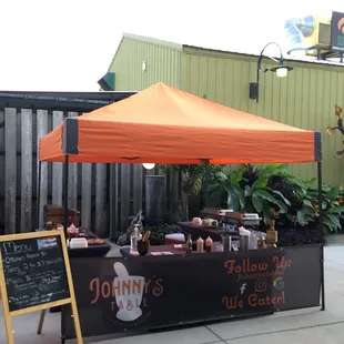 a table with a sign for johnny's