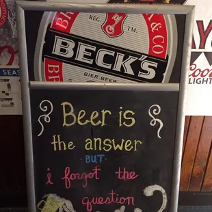 a blackboard with a sign that says beer is the answer but i forgot the question