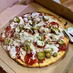 Gluten free pepperoni, Italian sausage, and jalapeño pizza.  Take out.