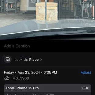Screenshot of a photo taken of the curbside parking only sign with date and time.