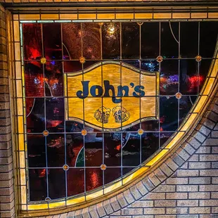 Our original stained glass window that still greets you as you walk in