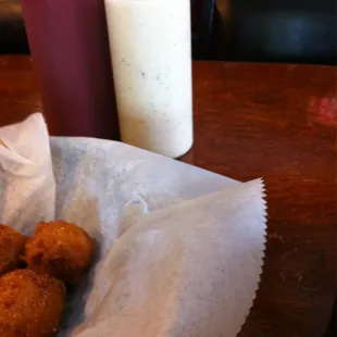 Complimentary hush puppies served with two types of dipping sauce.