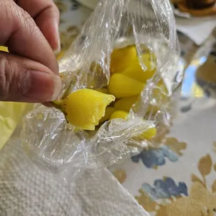 a person holding a bag of food