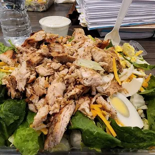 Grilled chicken salad with egg and cheese  I enjoy it dry, but I'm sure it's just as good with dressing.