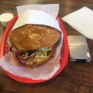 Pastrami burger add avocado vs. slightly bigger than card sized wallet. I have huge hands and still had trouble handling it