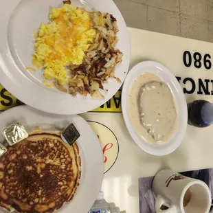 Cheese eggs pancake hashbrowns and chicken fried steak