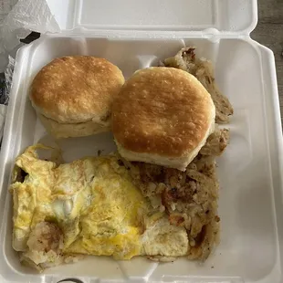 Sausage and cheese egg omelette with hash browns and biscuits