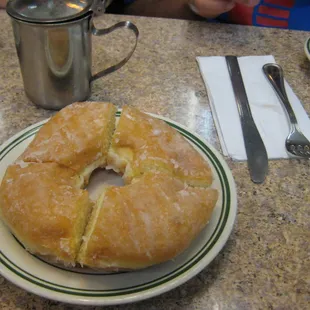 a half eaten donut on a plate