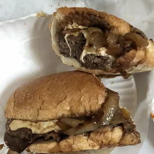 a half eaten sandwich and half eaten fries