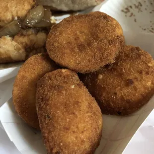 a plate of fried food and a sandwich