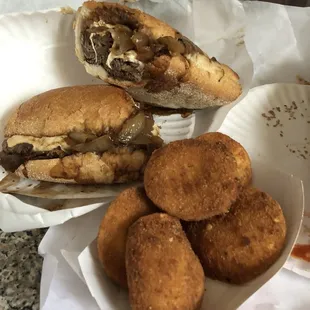 a sandwich with a side of tater tots