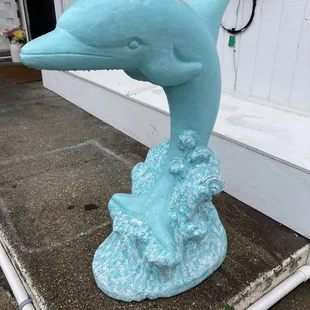 a blue dolphin statue