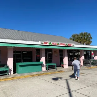 a man walking in front of the store