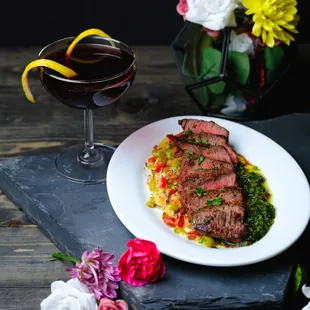 Flank steak appetizer with mint chimichurri and pepper relish