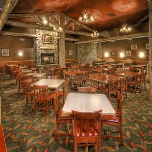 Cabin Fever: A quiet and relaxing Lake Tahoe style environment with chunky pine chairs, log covered walls and a warm fireplace