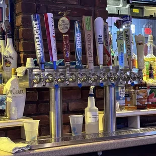 a row of beer taps