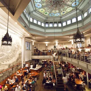 Main dining room of John's, including original stained glass from 19th century church.