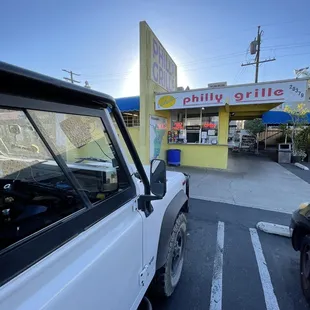 a car parked in front of a restaurant