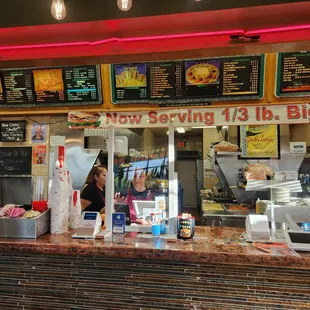a restaurant counter with menus