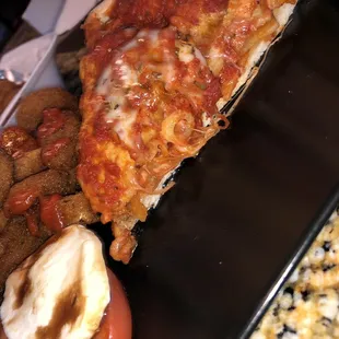 a slice of pizza on a plate