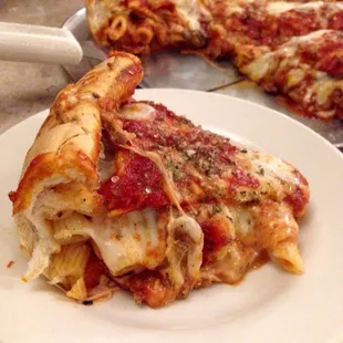 Stuffed pizza with pasta, meatball, and mushroom