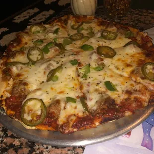 Sausage pizza with green peppers, onions, and jalapeños!