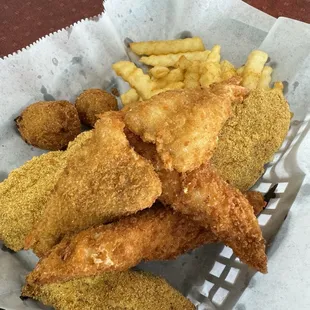 a basket of fried fish and fries