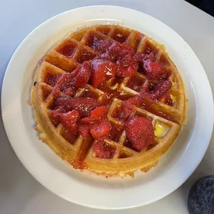 Belgium waffle with butter and strawberry topping