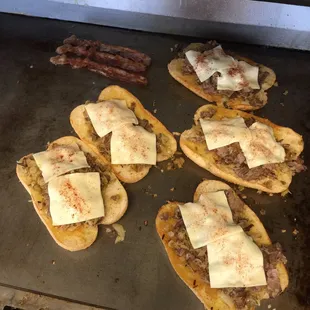 a pancake with sausage and cheese on it