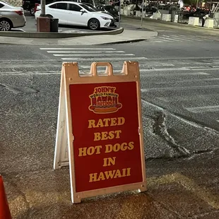 a sign that reads rated best hot dogs in hawaii