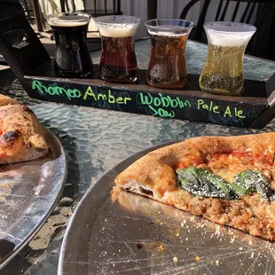 Beer flight and pizza on the patio