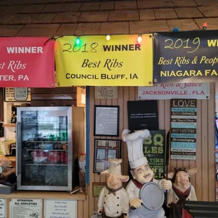 ows a couple of statues of chefs