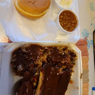 Sampler Platter. Chopped Pork, Chopped Brisket, Ribs,  Chicken, baked beans, coleslaw and a roll.