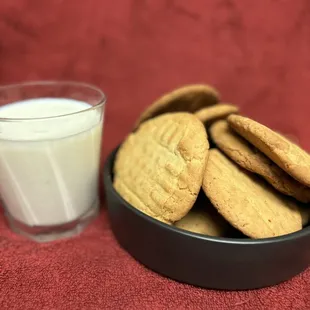 a bowl of cookies and a glass of milk