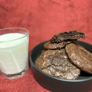 a bowl of cookies and a glass of milk