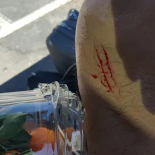 a person&apos;s head and a blender full of carrots