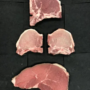 three pieces of raw meat