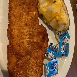 a plate of fish and potatoes