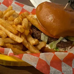 a burger and fries in a basket