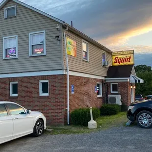 two cars parked in front of the inn