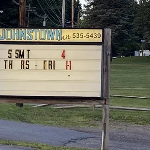 a church sign on the side of the road