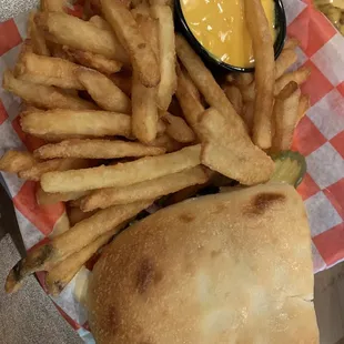 Bacon cheeseburger on homemade bread with fries