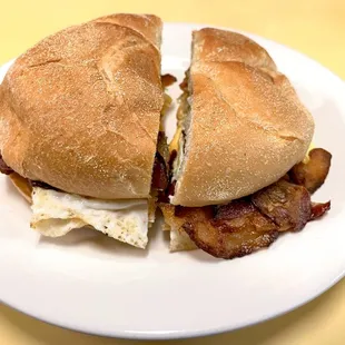 Bacon, egg, and cheese sandwich. Two eggs. Comes with one cup of coffee. $5.25 + tax + tip