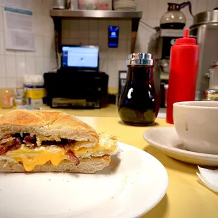 Bacon, egg, and cheese sandwich. Two eggs. Comes with one cup of coffee. $5.25 + tax + tip